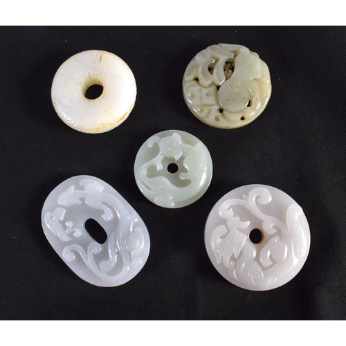 1503 - A GROUP OF NINE 19TH/20TH CENTURY CHINESE CARVED JADE BI DISCS in various forms and sizes. Largest 6... 