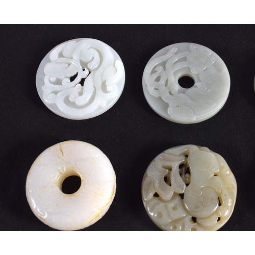 1503 - A GROUP OF NINE 19TH/20TH CENTURY CHINESE CARVED JADE BI DISCS in various forms and sizes. Largest 6... 