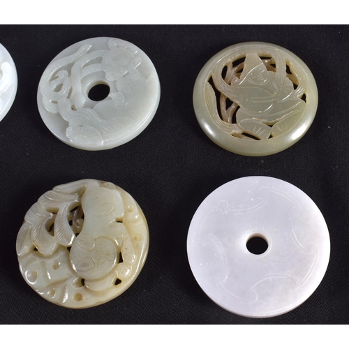 1503 - A GROUP OF NINE 19TH/20TH CENTURY CHINESE CARVED JADE BI DISCS in various forms and sizes. Largest 6... 