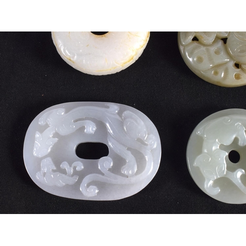 1503 - A GROUP OF NINE 19TH/20TH CENTURY CHINESE CARVED JADE BI DISCS in various forms and sizes. Largest 6... 