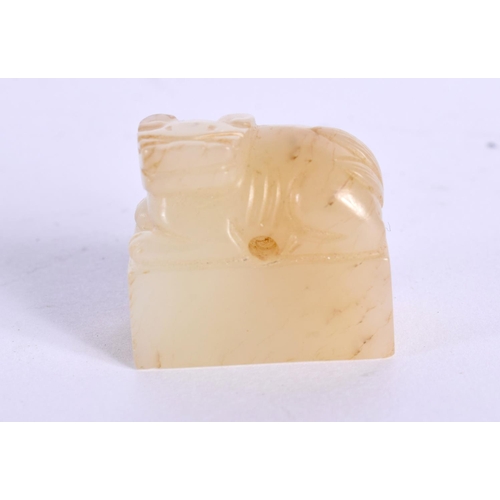 1522 - A CHINESE CARVED YELLOWISH JADE SEAL 20th Century, together with an archaic jade plaque. Largest 10 ... 