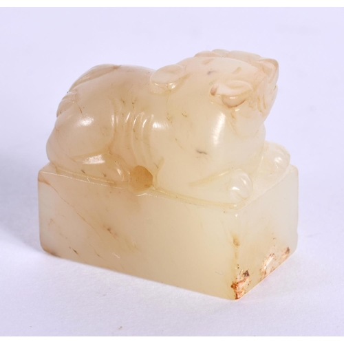 1522 - A CHINESE CARVED YELLOWISH JADE SEAL 20th Century, together with an archaic jade plaque. Largest 10 ... 