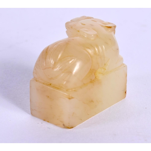 1522 - A CHINESE CARVED YELLOWISH JADE SEAL 20th Century, together with an archaic jade plaque. Largest 10 ... 