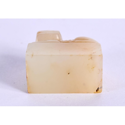 1522 - A CHINESE CARVED YELLOWISH JADE SEAL 20th Century, together with an archaic jade plaque. Largest 10 ... 