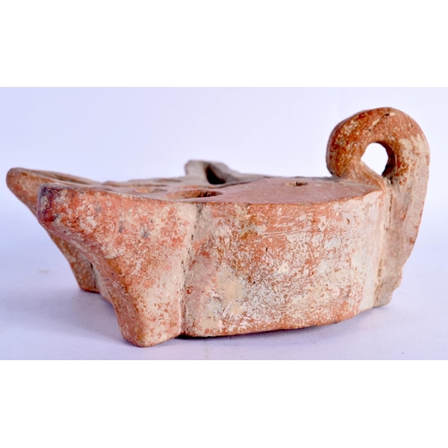 1569 - AN UNUSUAL 11TH/12TH CENTURY MIDDLE EASTERN POTTERY TRIPLE SPOUT LAMP. 15 cm x 13 cm.