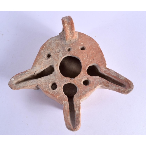 1569 - AN UNUSUAL 11TH/12TH CENTURY MIDDLE EASTERN POTTERY TRIPLE SPOUT LAMP. 15 cm x 13 cm.