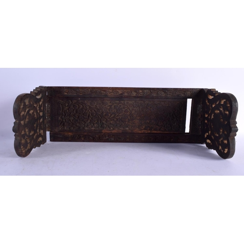 1576 - A MIDDLE EASTERN ISLAMIC CARVED WOOD SLIDING BOOK RACK. 60 cm x 15 cm extended.