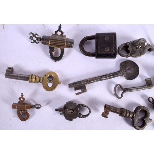 1602 - A COLLECTION OF 18TH/19TH CENTURY MIDDLE EASTERN AND INDIAN LOCKS & KEYS. Largest 9 cm x 11 cm. (qty... 