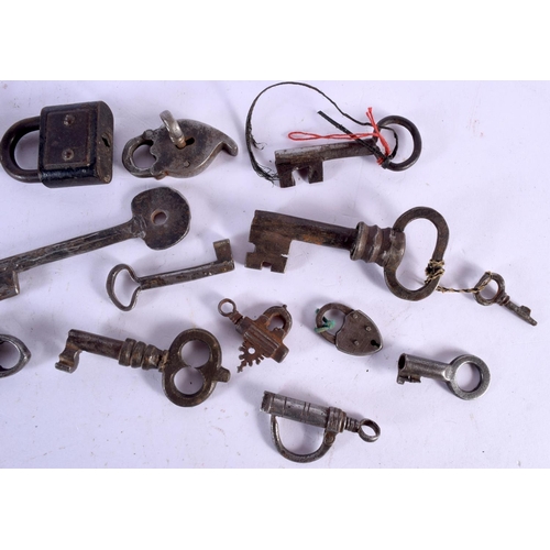 1602 - A COLLECTION OF 18TH/19TH CENTURY MIDDLE EASTERN AND INDIAN LOCKS & KEYS. Largest 9 cm x 11 cm. (qty... 