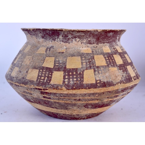 1603 - THREE 11TH/12TH CENTURY MIDDLE EASTERN POTTERY VESSELS. Largest 22 cm x 14 cm. (3)