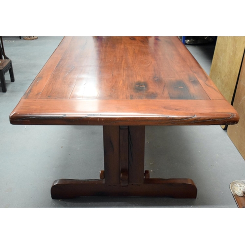 1604 - AN EARLY 20TH CENTURY CHINESE CARVED HEAVY HARDWOOD DINING TABLE with eight matching chairs, the tab... 