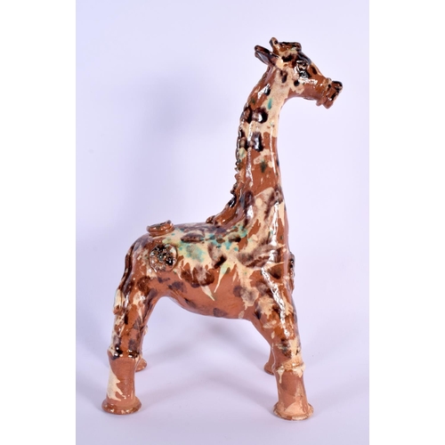 1619 - A TURKISH CANAKKALE POTTERY FIGURE OF A GIRAFFE. 32 cm x 15 cm.