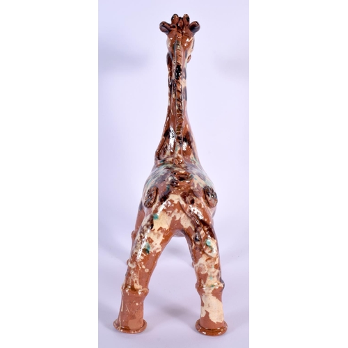 1619 - A TURKISH CANAKKALE POTTERY FIGURE OF A GIRAFFE. 32 cm x 15 cm.