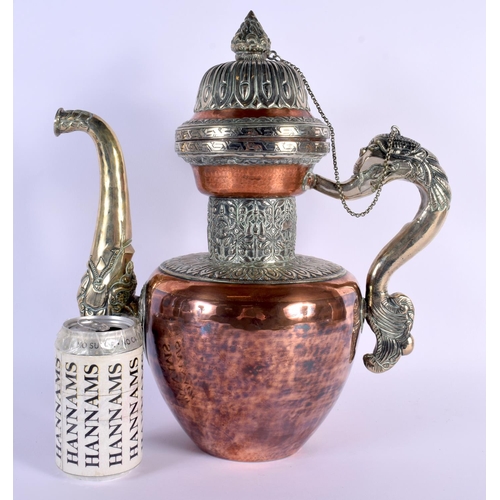 1626 - A LARGE 19TH CENTURY TIBETAN MIXED METAL SILVER EWER decorated with buddhistic emblems. 36 cm x 26 c... 