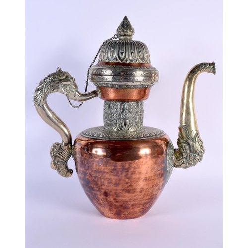 1626 - A LARGE 19TH CENTURY TIBETAN MIXED METAL SILVER EWER decorated with buddhistic emblems. 36 cm x 26 c... 