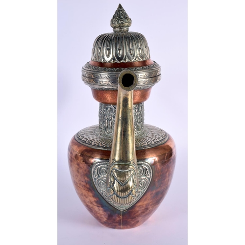 1626 - A LARGE 19TH CENTURY TIBETAN MIXED METAL SILVER EWER decorated with buddhistic emblems. 36 cm x 26 c... 