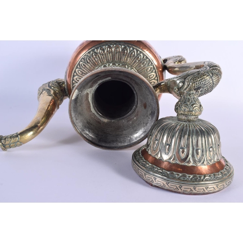 1626 - A LARGE 19TH CENTURY TIBETAN MIXED METAL SILVER EWER decorated with buddhistic emblems. 36 cm x 26 c... 