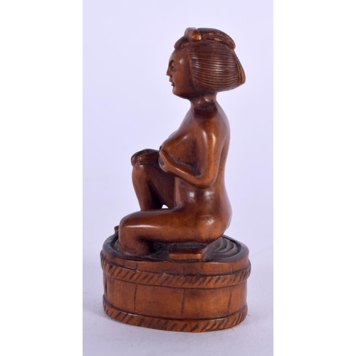 1630 - A JAPANESE TAISHO PERIOD CARVED BOXWOOD NETSUKE formed as a nude female. 6 cm x 3 cm.