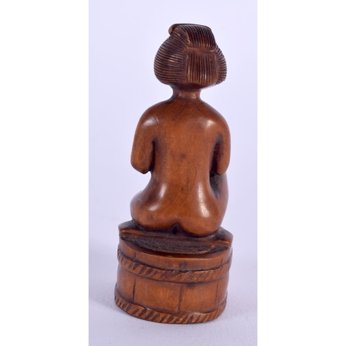 1630 - A JAPANESE TAISHO PERIOD CARVED BOXWOOD NETSUKE formed as a nude female. 6 cm x 3 cm.