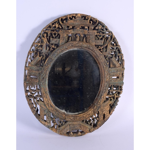 1631 - A LATE 19TH CENTURY CHINESE CARVED GILTWOOD MIRROR Qing, decorated with figures. 30 cm x 24 cm.