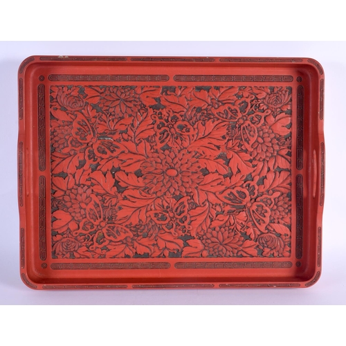 1632 - A LARGE EARLY 20TH CENTURY JAPANESE MEIJI PERIOD RED LACQUERED TRAY decorated all over with foliage ... 