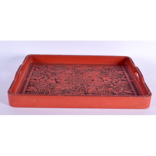 1632 - A LARGE EARLY 20TH CENTURY JAPANESE MEIJI PERIOD RED LACQUERED TRAY decorated all over with foliage ... 