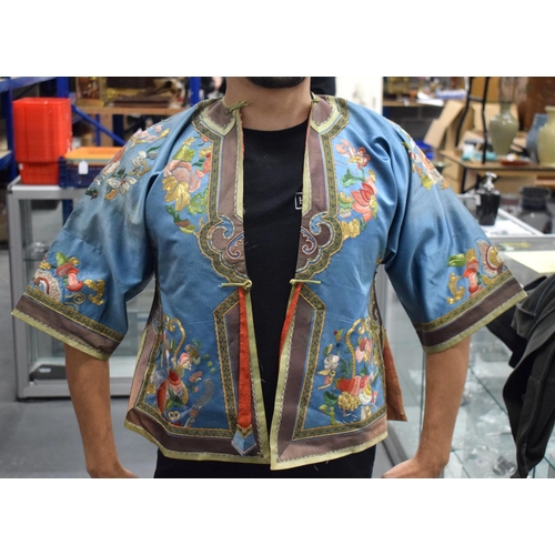 1636 - A LATE 19TH CENTURY CHINESE BLUE CHILDS SILK WORK EMBROIDERED JACKET decorated with foliage. 105 cm ... 