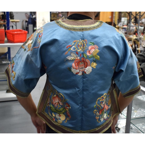 1636 - A LATE 19TH CENTURY CHINESE BLUE CHILDS SILK WORK EMBROIDERED JACKET decorated with foliage. 105 cm ... 