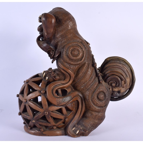 1661 - A RARE LARGE 19TH CENTURY CHINESE POTTERY FIGURE OF A BUDDHISTIC BEAST modelled upon an openwork bal... 