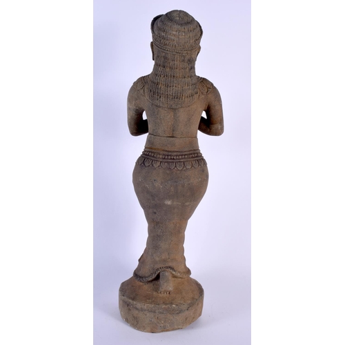 1662 - AN UNUSUAL 19TH CENTURY SOUTH EAST ASIAN CAMBODIAN STONE FIGURE modelled as a buddhistic deity, with... 