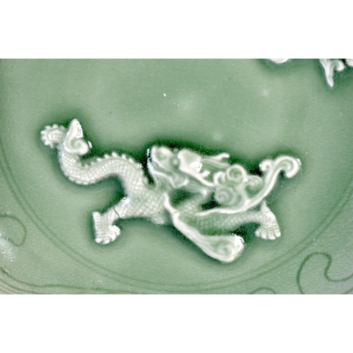 1667 - AN EARLY 20TH CENTURY CHINESE KOREAN CELADON POTTERY DISH decorated with dragons amongst clouds. 25 ... 