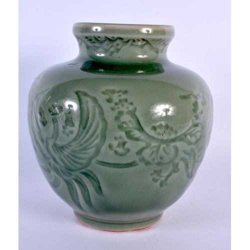 1672 - AN EARLY 20TH CENTURY CHINESE KOREAN CELADON INCISED JAR decorated with birds and flowers. 18 cm x 1... 