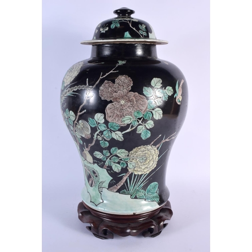 1673 - A LARGE 19TH CENTURY CHINESE FAMILLE NOIRE PORCELAIN VASE AND COVER Kangxi style, painted with birds... 