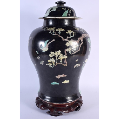 1673 - A LARGE 19TH CENTURY CHINESE FAMILLE NOIRE PORCELAIN VASE AND COVER Kangxi style, painted with birds... 