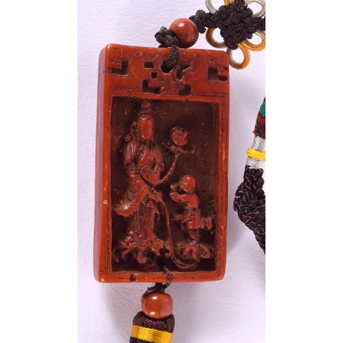 1700 - AN EARLY 20TH CENTURY CHINESE CARVED AND STAINED PENDANT possibly Hornbill, together with a jade nec... 