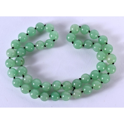 1702 - A CHINESE JADEITE NECKLACE 20th Century. 103 grams. 60 cm long.