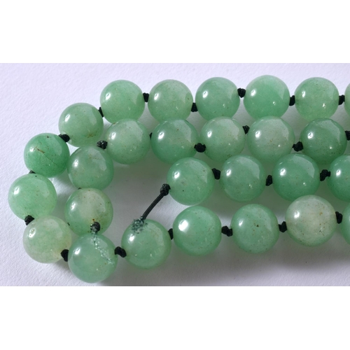 1702 - A CHINESE JADEITE NECKLACE 20th Century. 103 grams. 60 cm long.