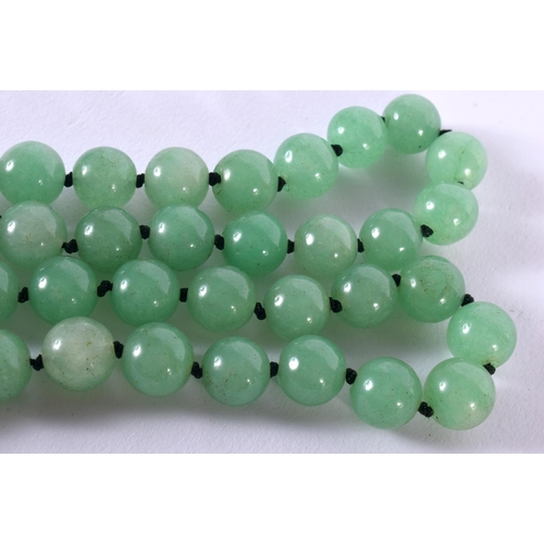 1702 - A CHINESE JADEITE NECKLACE 20th Century. 103 grams. 60 cm long.