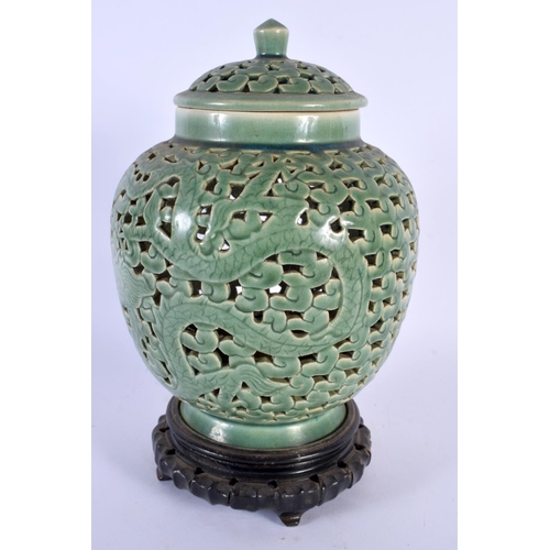 1721 - AN UNUSUAL 19TH CENTURY CHINESE CELADON RETICULATED VASE AND COVER Qing. 28 cm x 12 cm.