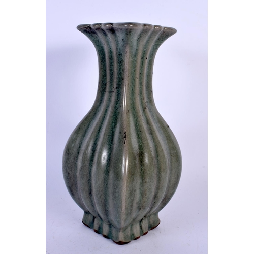 1725 - A CHINESE CELADON STONEWARE RIBBED VASE 20th Century. 23 cm high.