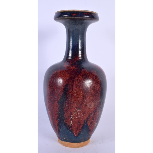 1726 - A CHINESE RED GLAZED STONEWARE VASE 20th Century. 22 cm high.