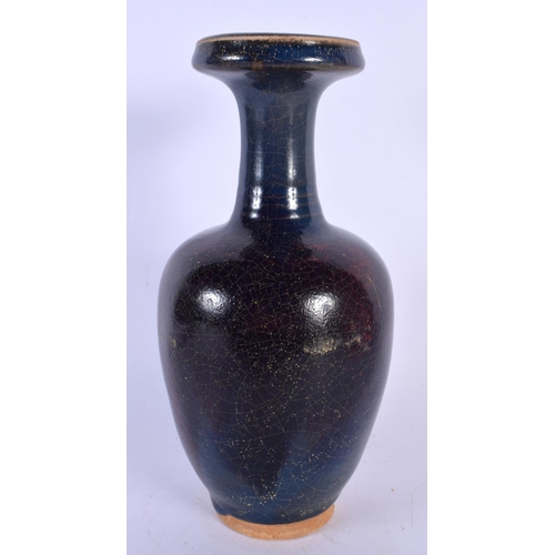 1726 - A CHINESE RED GLAZED STONEWARE VASE 20th Century. 22 cm high.