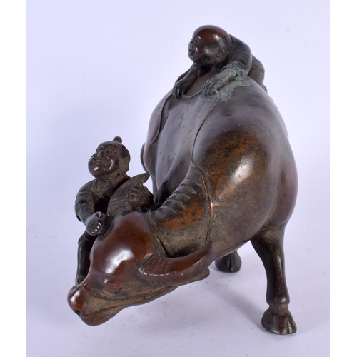 1733 - A CHINESE BRONZE FIGURE OF A BUFFALO 20th Century. 14 cm x 14 cm.