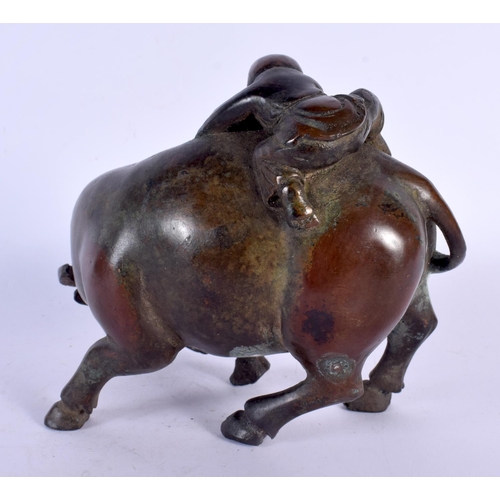 1733 - A CHINESE BRONZE FIGURE OF A BUFFALO 20th Century. 14 cm x 14 cm.