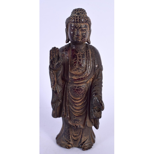 1769 - A CHINESE CARVED BUFFALO HORN TYPE FIGURE OF A STANDING BUDDHA 20th Century. 180 grams. 15 cm high.