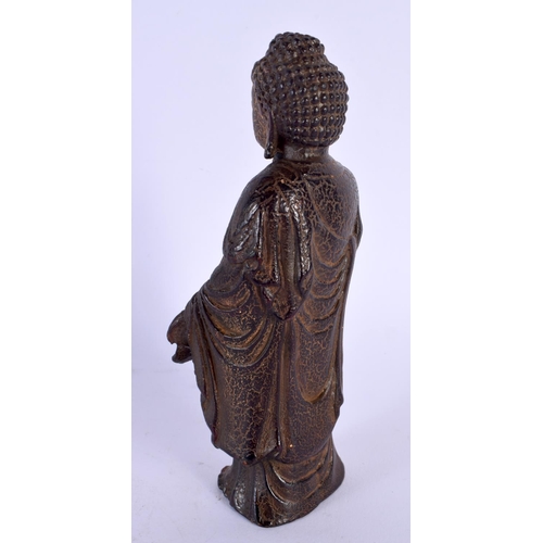 1769 - A CHINESE CARVED BUFFALO HORN TYPE FIGURE OF A STANDING BUDDHA 20th Century. 180 grams. 15 cm high.