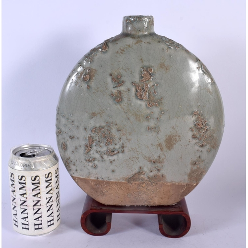 1785 - AN UNUSUAL EARLY 20TH CENTURY CHINESE KOREAN MOON FLASK with natural glaze pitting. 30 cm x 20 cm.