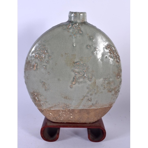 1785 - AN UNUSUAL EARLY 20TH CENTURY CHINESE KOREAN MOON FLASK with natural glaze pitting. 30 cm x 20 cm.