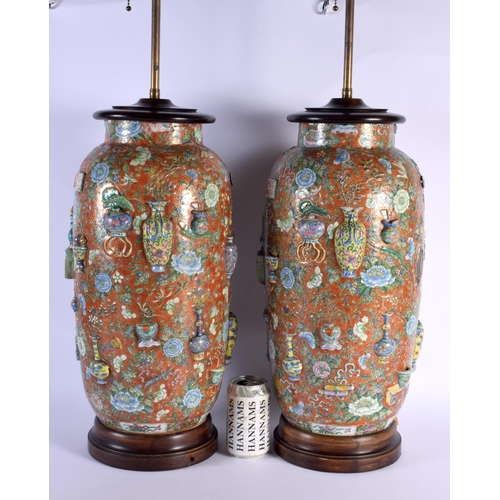 1794 - A VERY UNUSUAL PAIR OF 19TH CENTURY CHINESE CORAL GROUND PORCELAIN LAMPS bearing Chenghua marks to b... 