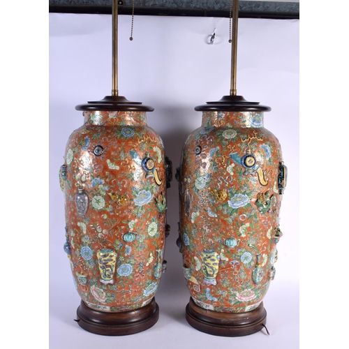 1794 - A VERY UNUSUAL PAIR OF 19TH CENTURY CHINESE CORAL GROUND PORCELAIN LAMPS bearing Chenghua marks to b... 